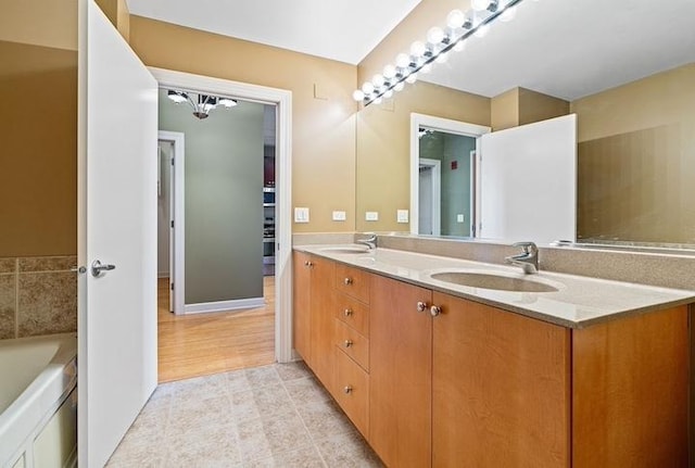 bathroom featuring vanity and a tub