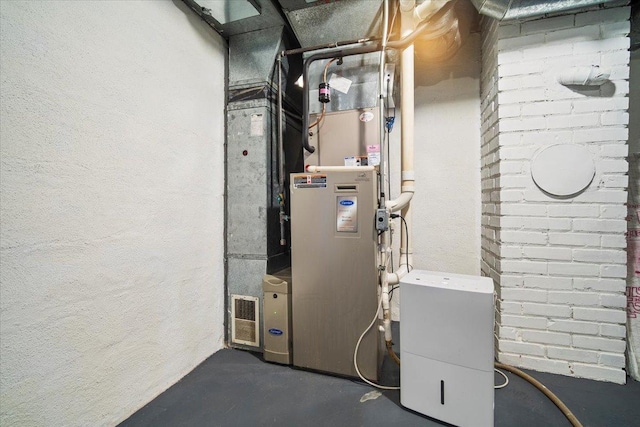 utility room featuring heating unit