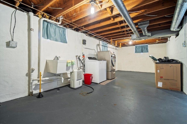 basement with separate washer and dryer and sink