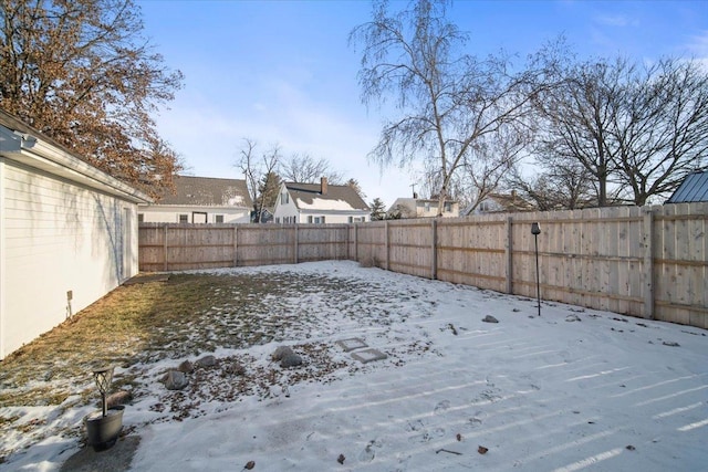 view of yard covered in snow