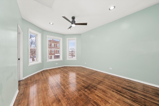 empty room featuring hardwood / wood-style floors and ceiling fan