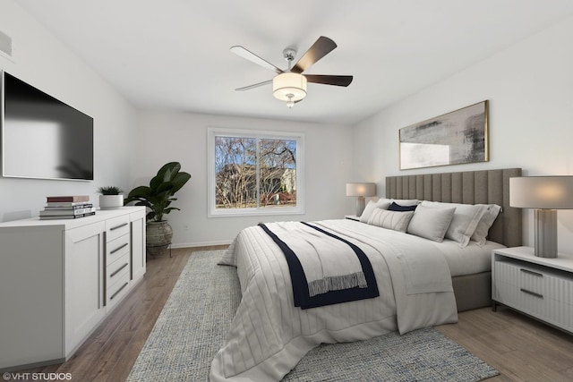 bedroom featuring dark hardwood / wood-style floors and ceiling fan