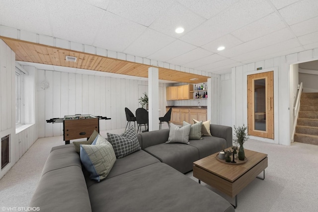 carpeted living room featuring sink