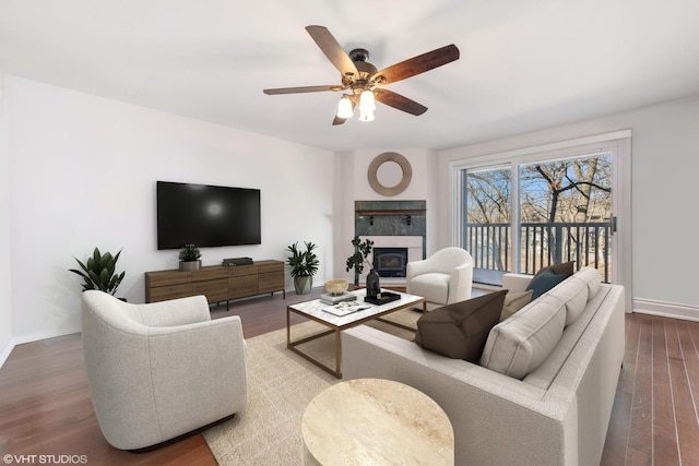 living room featuring hardwood / wood-style flooring and ceiling fan