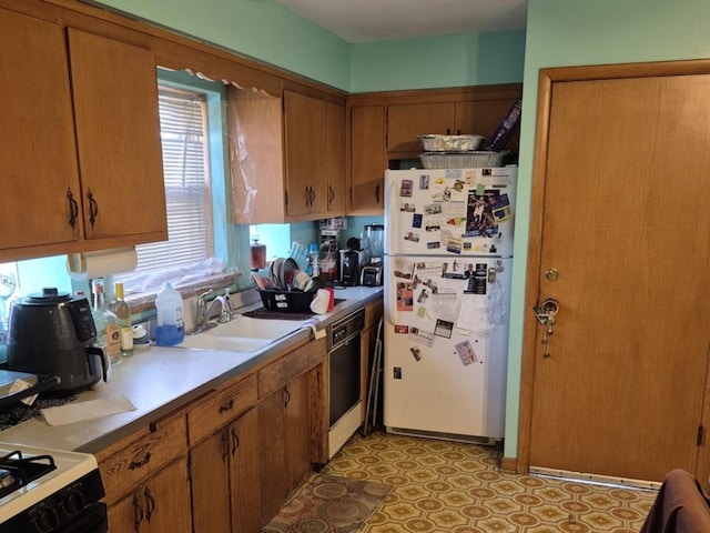 kitchen featuring sink and black appliances