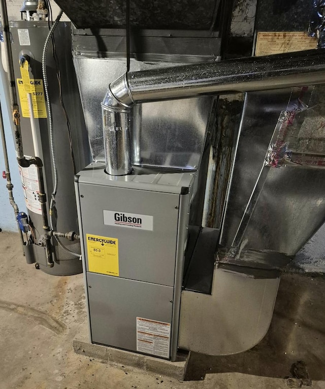 utility room featuring gas water heater