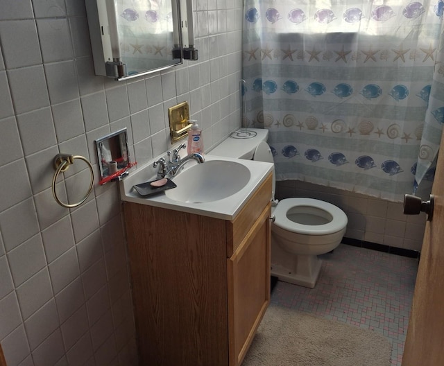 bathroom with tile walls, tasteful backsplash, and tile patterned floors