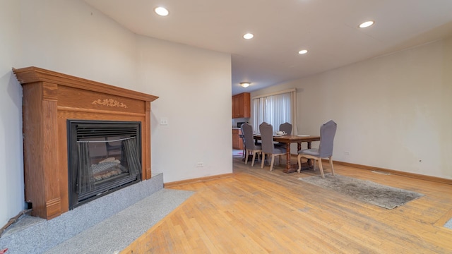 living room with light hardwood / wood-style flooring