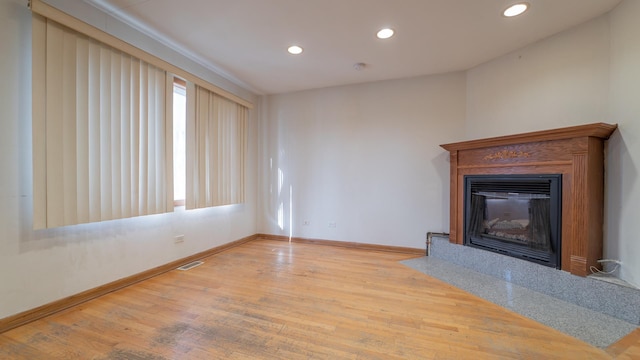 unfurnished living room with light hardwood / wood-style flooring