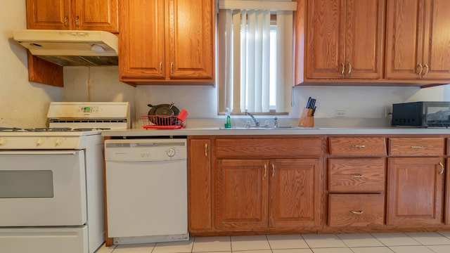 kitchen with light tile patterned floors and white appliances