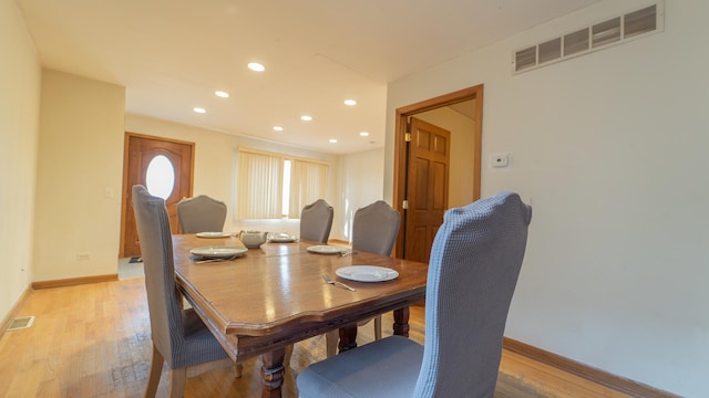 dining area with light hardwood / wood-style flooring