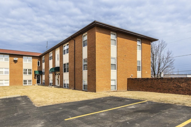 view of property featuring uncovered parking