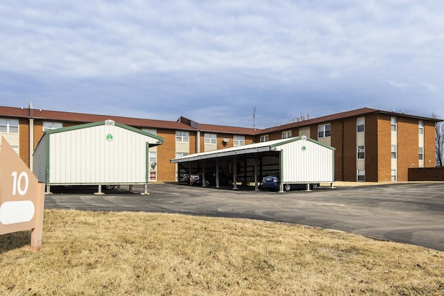 view of outdoor structure featuring covered parking