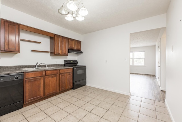 kitchen featuring dark countertops, under cabinet range hood, black appliances, open shelves, and a sink