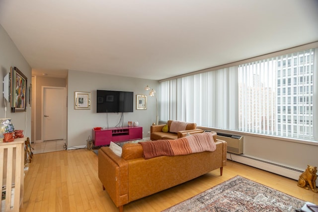 living room with a baseboard radiator and light wood-type flooring