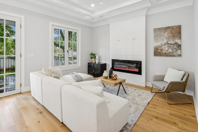 living room with coffered ceiling, light hardwood / wood-style flooring, a large fireplace, and beamed ceiling