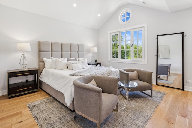 bedroom with light hardwood / wood-style flooring and vaulted ceiling