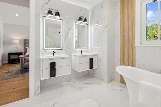 bathroom featuring vanity and a bathing tub