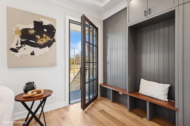 mudroom with light hardwood / wood-style floors