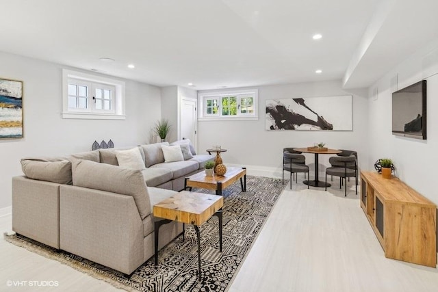 living room with light hardwood / wood-style flooring