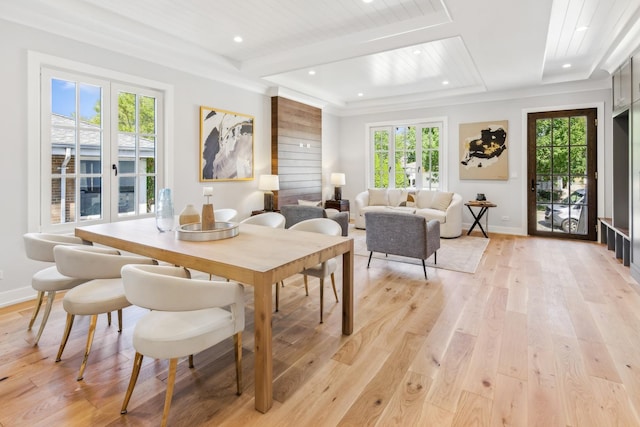 dining room with wood ceiling, light hardwood / wood-style flooring, and french doors