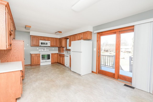 kitchen with sink and white appliances