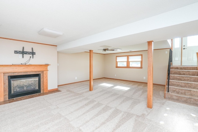 basement with light colored carpet and a fireplace