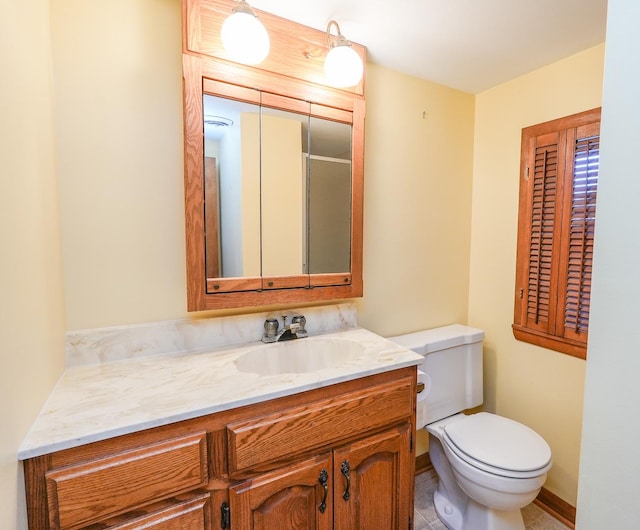 bathroom with vanity and toilet