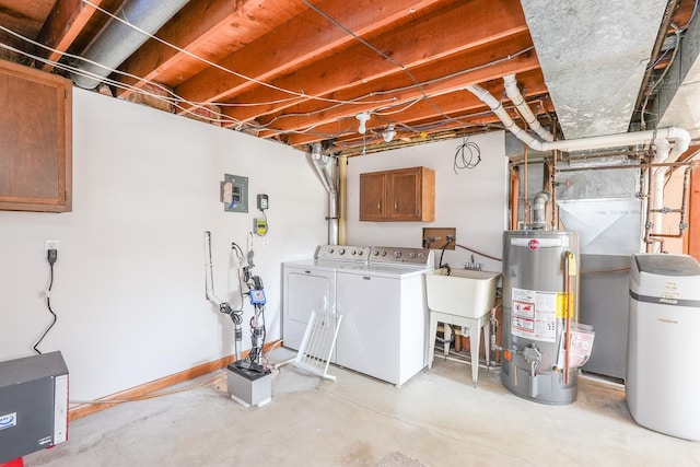 basement featuring electric panel, separate washer and dryer, sink, and gas water heater