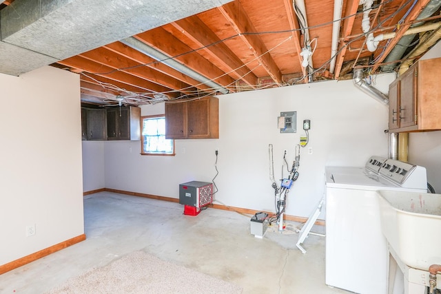 basement featuring washer and dryer and sink