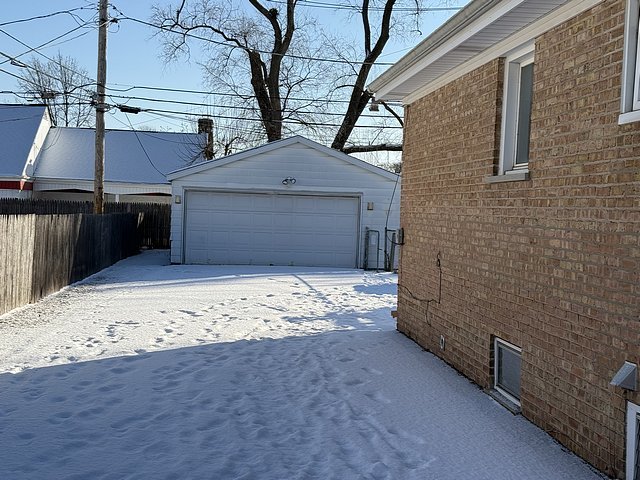 view of snow covered garage