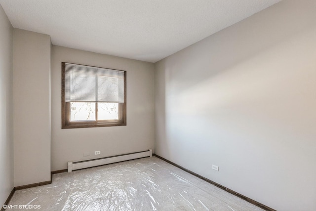 unfurnished room with a baseboard radiator