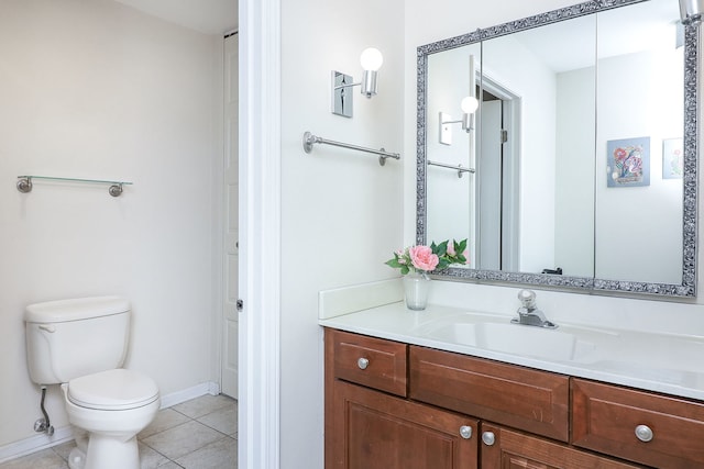 bathroom featuring tile patterned floors, toilet, and vanity