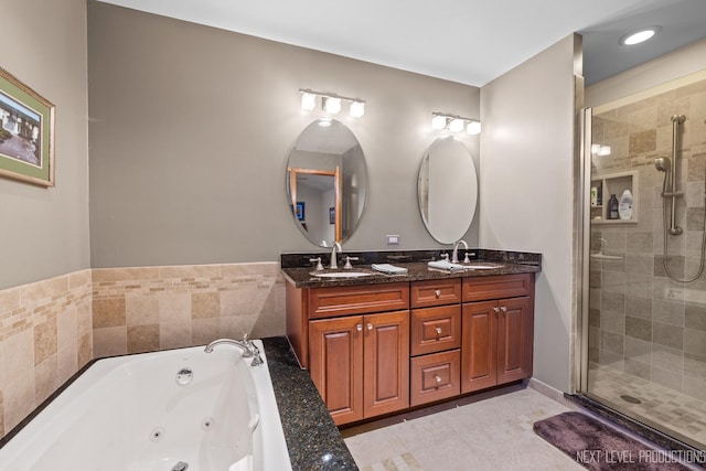 bathroom with tile patterned floors, vanity, and plus walk in shower