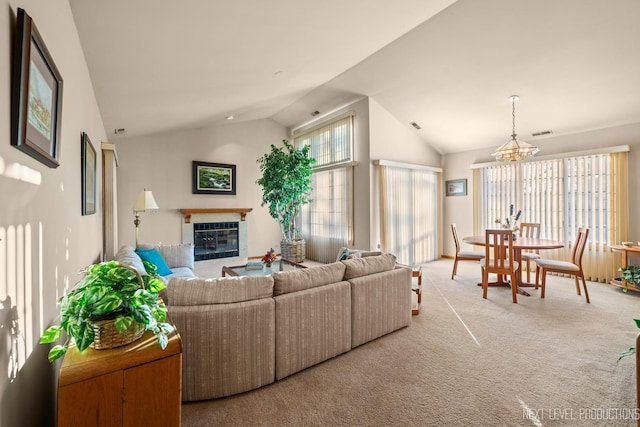 living room with light carpet and high vaulted ceiling