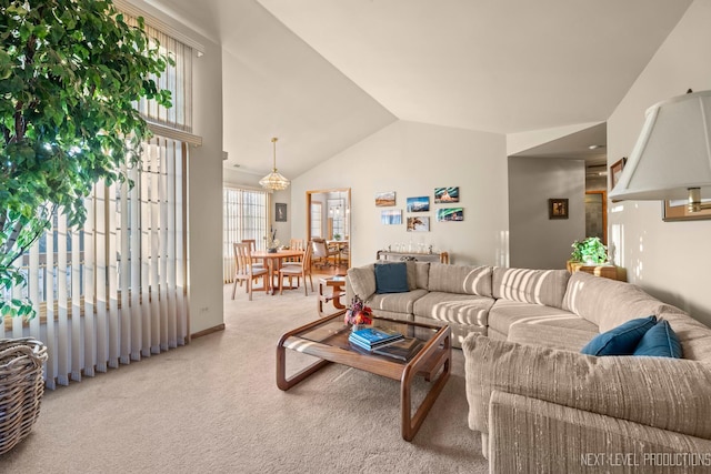 living room featuring lofted ceiling and carpet flooring