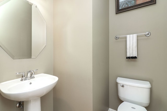 bathroom with sink and toilet