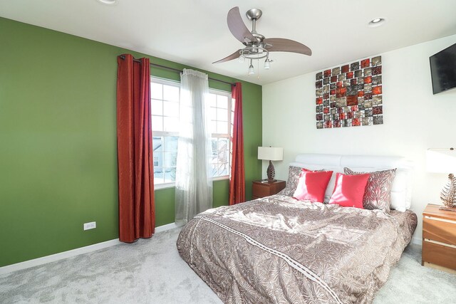 carpeted bedroom with ceiling fan