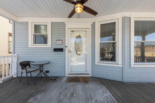 entrance to property with ceiling fan