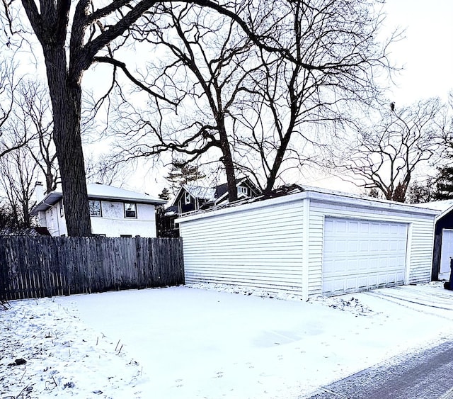 view of snow covered garage