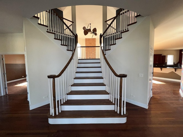 staircase featuring wood-type flooring