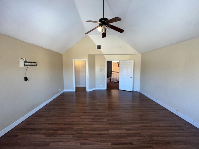 interior space with ceiling fan, dark hardwood / wood-style floors, and vaulted ceiling