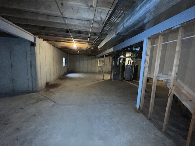 basement with heating unit and gas water heater