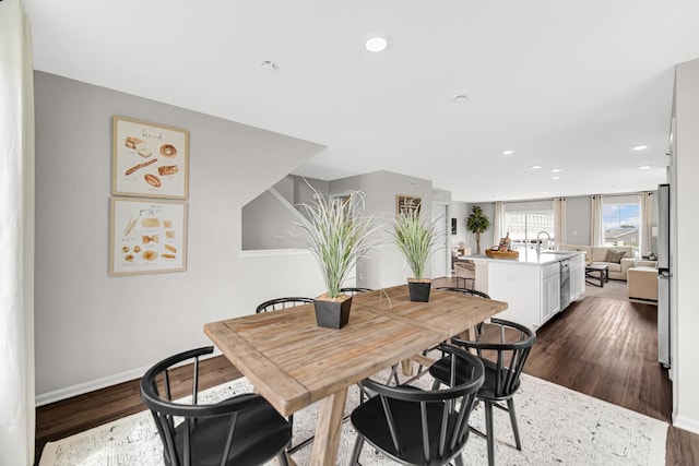 dining room featuring dark hardwood / wood-style floors and sink