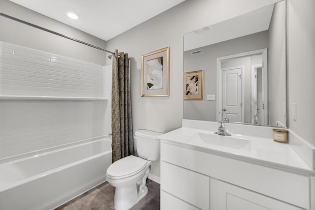 full bathroom featuring shower / bath combination with curtain, vanity, and toilet