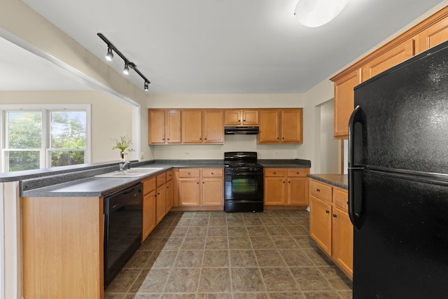 kitchen featuring sink and black appliances