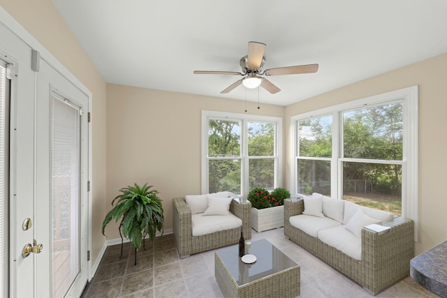 sunroom featuring ceiling fan