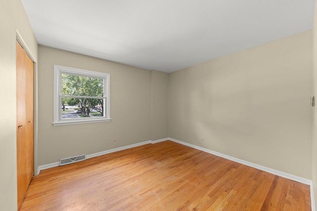 empty room with light wood-type flooring