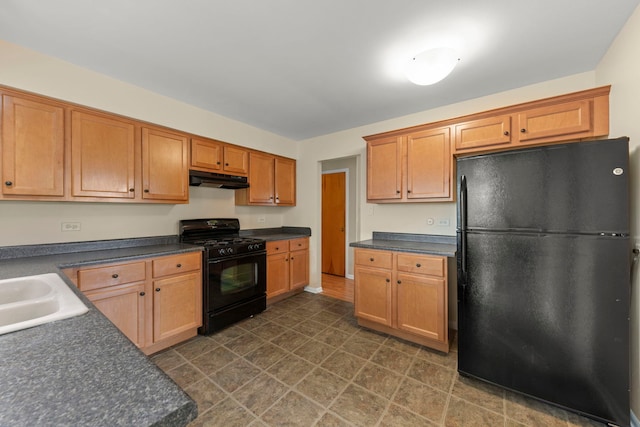 kitchen with sink and black appliances