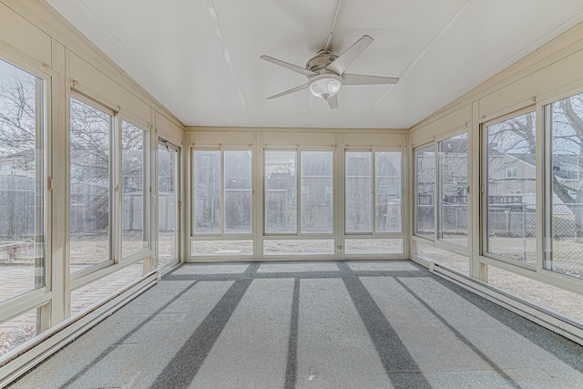 unfurnished sunroom with ceiling fan and a wealth of natural light